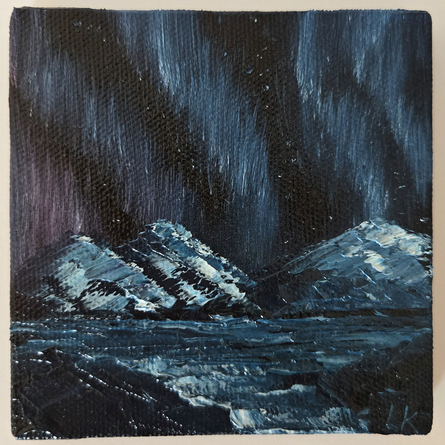 snow covered mountains with northern lights